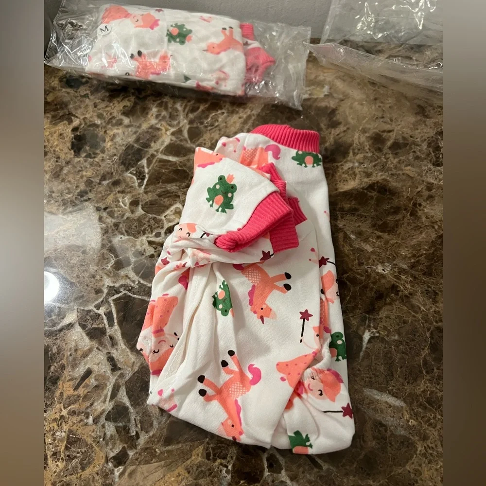 Weenie Warmers Princess Unicorn PJs feature happy little unicorns white & Pink